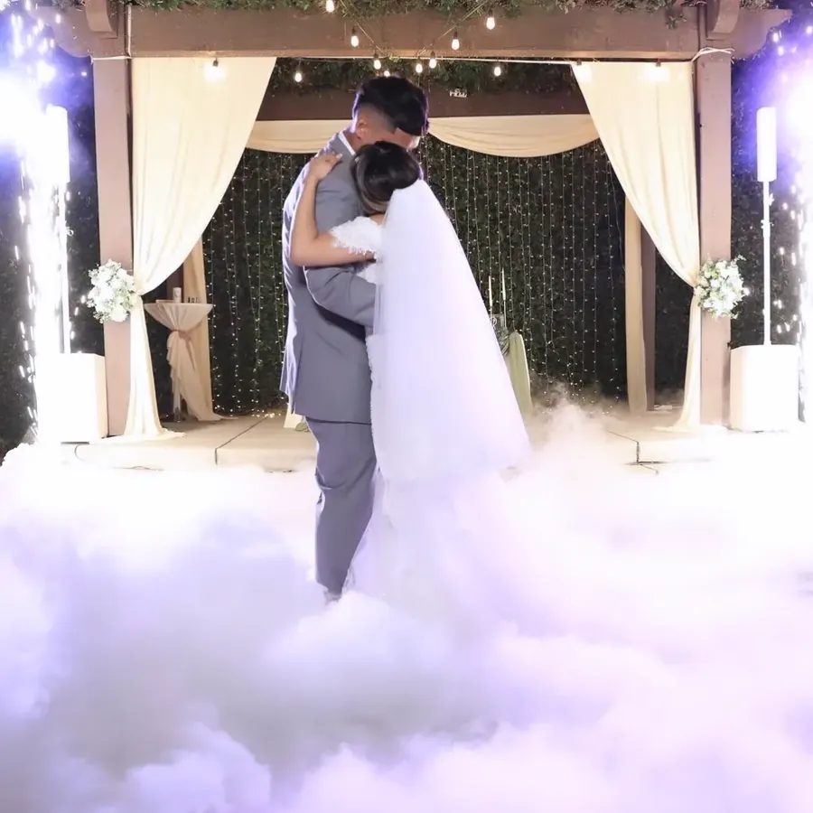 Bride and groom first dance on the clouds at Bakersfield wedding