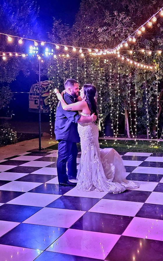First Dance under string lights at a Bakersfield Wedding reception
